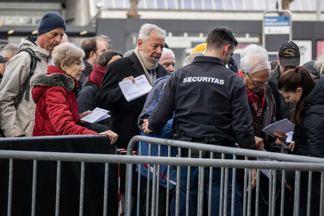 Credit Suisse shareholders went through security checks before entering the bank's annual general meeting at the Hallenstadion concert venue in Zurich Credit Suisse shareholders went through security checks before entering the bank's annual general meeting at the Hallenstadion concert venue in Zurich