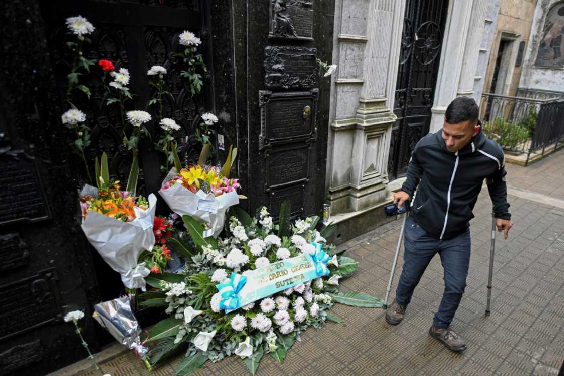 A man visits the tomb of political icon Eva Peron at the Recoleta cemetery in Buenos Aires, on July 26, 2022, to mark the 70th anniversary of her death