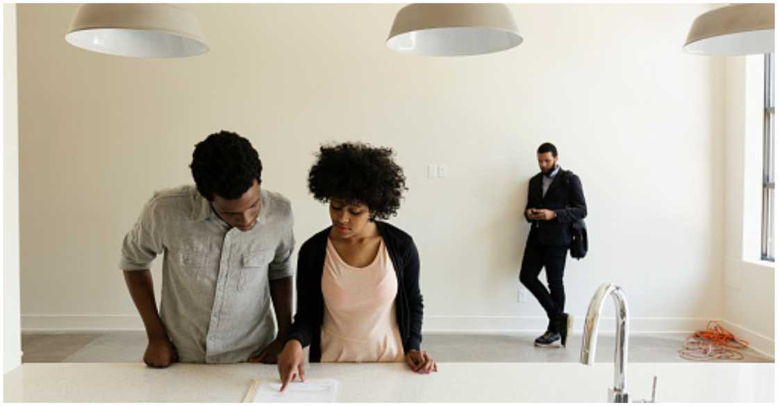 A couple check out a home they are considering to acquire