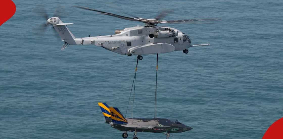 Helicopter lifts another mid-air Helicopter lifts another mid-air