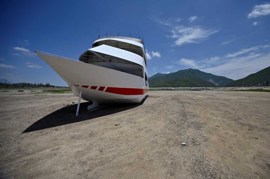A tourist boat left high and dry by receding waters at La Boca reservoir near Mexico's northern city of Monterrey A tourist boat left high and dry by receding waters at La Boca reservoir near Mexico's northern city of Monterrey