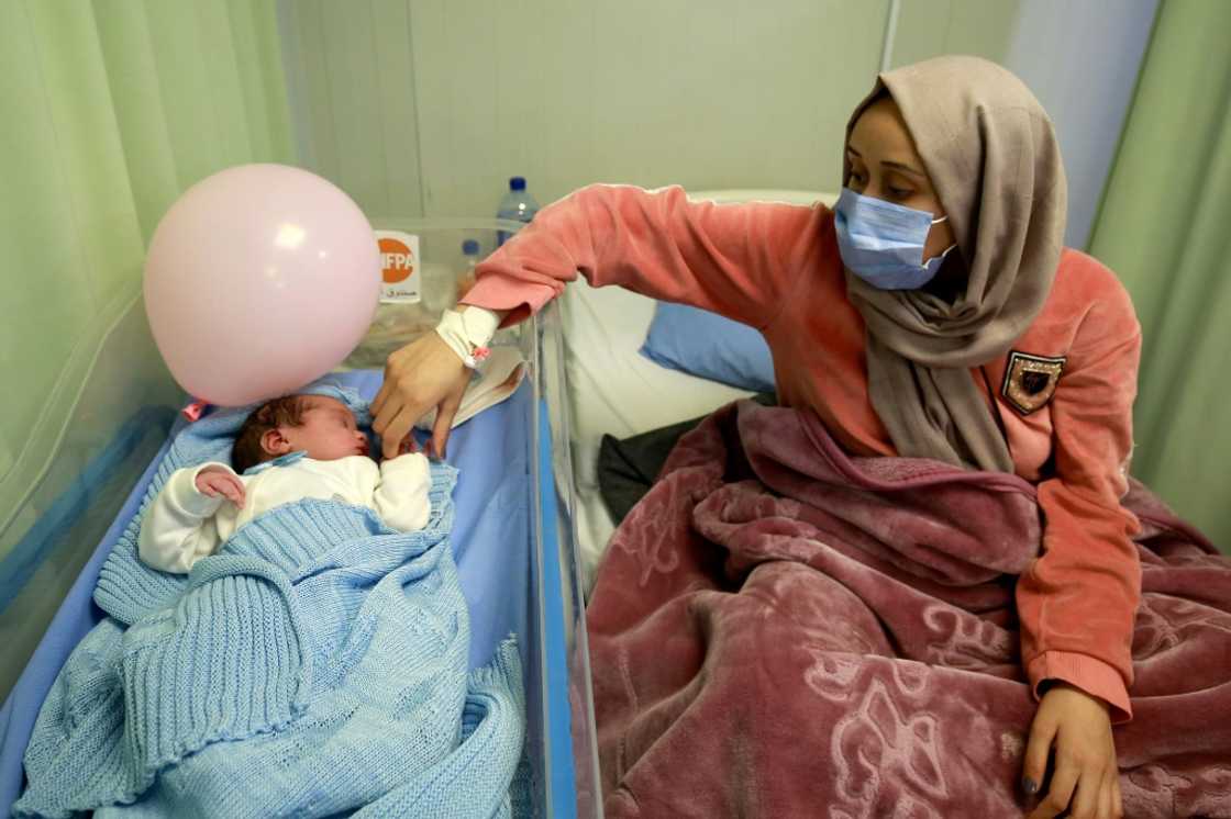 Syrian refugee Nagham Shagran, 20, watches over her newborn baby Zaid. At least 168,500 Syrian babies have been born in Jordan since 2014, according to the UN Syrian refugee Nagham Shagran, 20, watches over her newborn baby Zaid. At least 168,500 Syrian babies have been born in Jordan since 2014, according to the UN