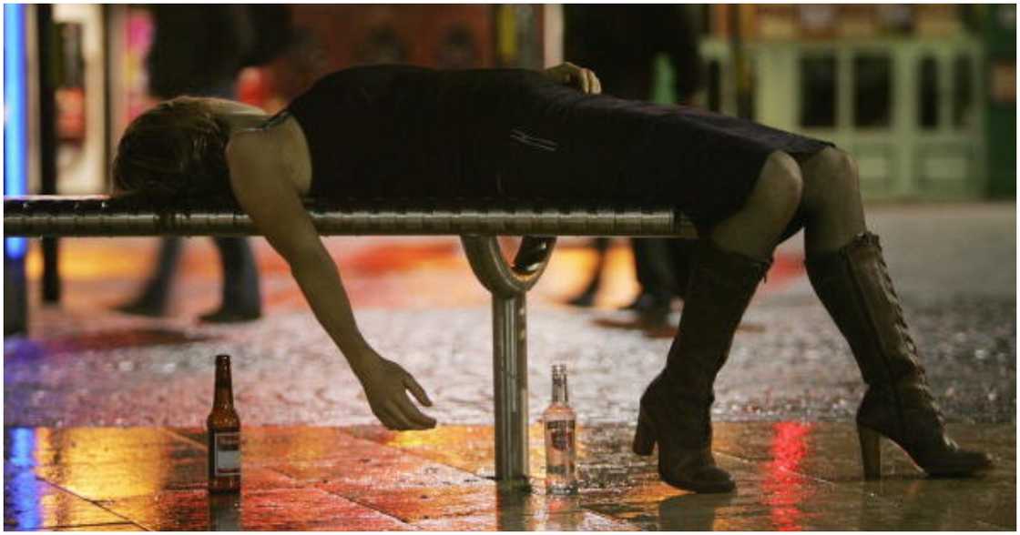A woman lies on a bench after leaving a bar in Bristol City Centre on October 15, 2005 in Bristol, England A woman lies on a bench after leaving a bar in Bristol City Centre on October 15, 2005 in Bristol, England