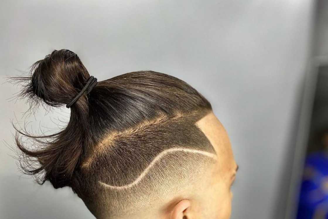 A topknot style + bald fade