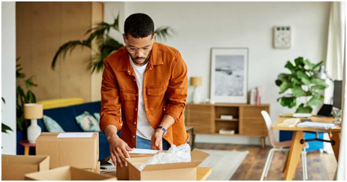 A young man moves into his new home