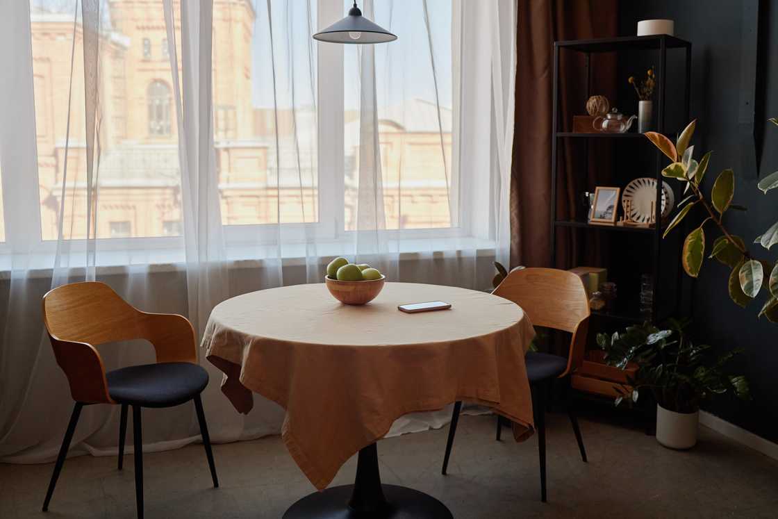 A phone on top of a dinning table