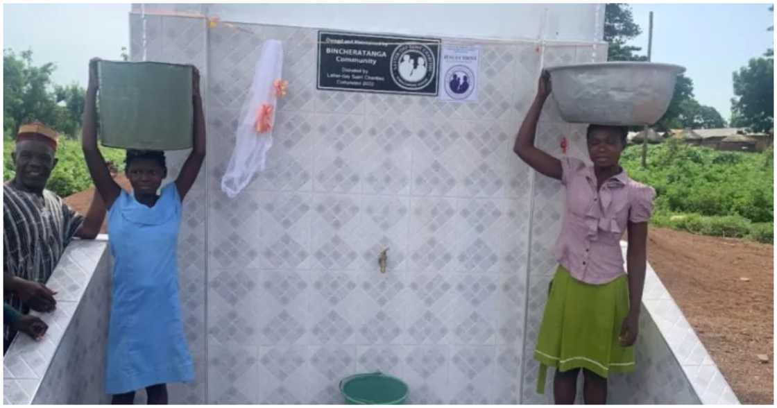 Girls fetch water from the new borehole project