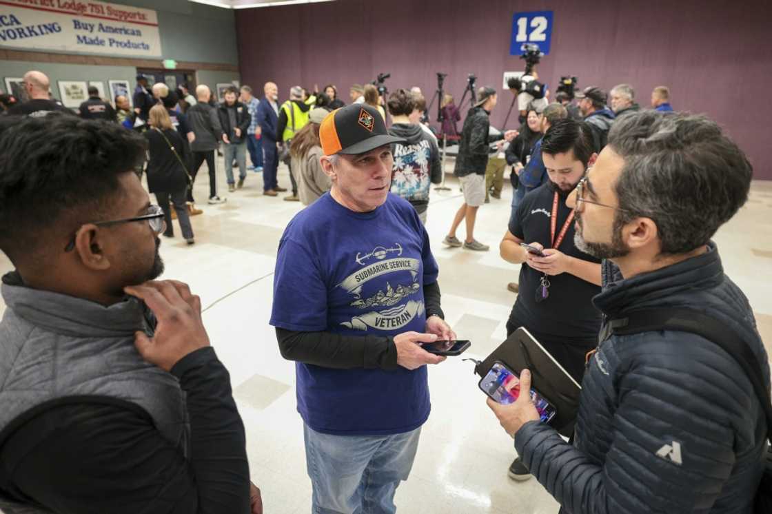 Boeing workers shown just after union leaders announced November 4 that the contract was ratified, ending a more than 50-day strike