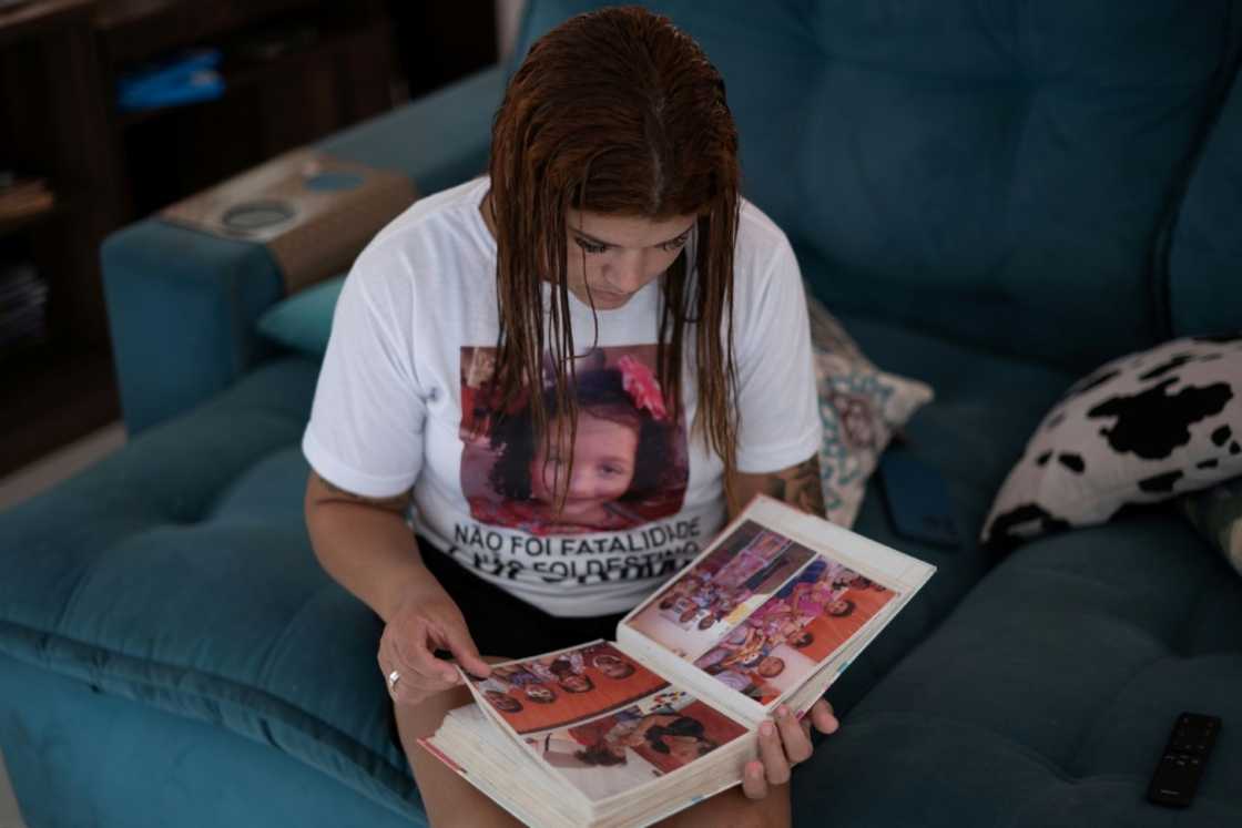 Fernandes's T-shirt shows a photo of her dead daughter and the words: 'This wasn't inevitable' Fernandes's T-shirt shows a photo of her dead daughter and the words: 'This wasn't inevitable'