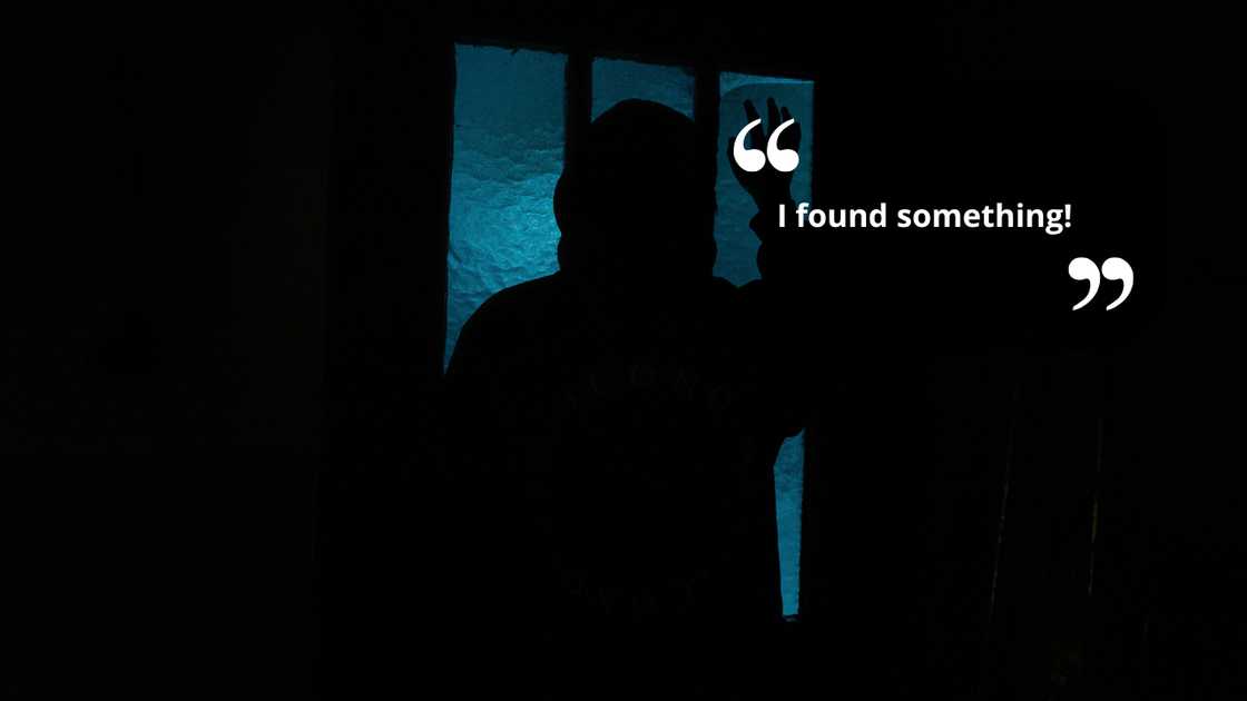 A silhoutte of a person in a dark room