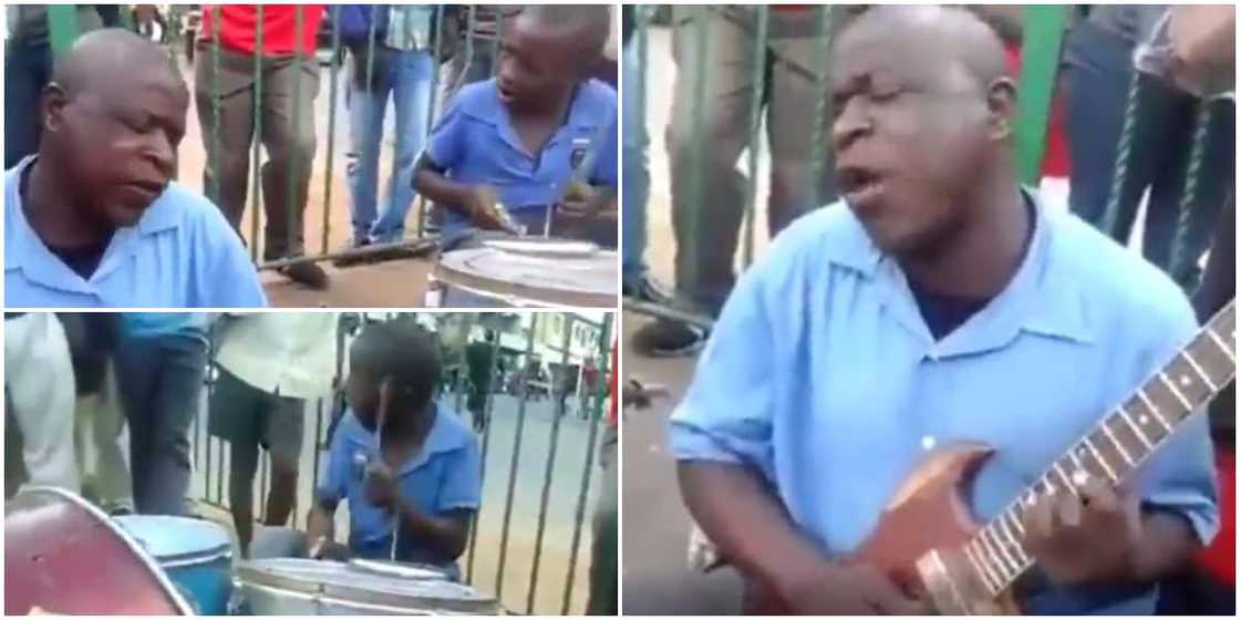 Visually impaired guitarist man and drummer son perform on street, wow people with their talents Visually impaired guitarist man and drummer son perform on street, wow people with their talents