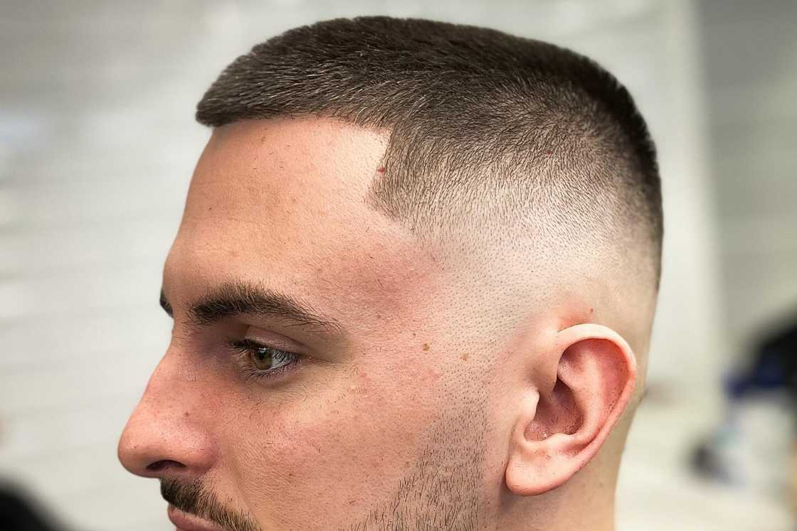 A man rocks a high buzz cut style A man rocks a high buzz cut style