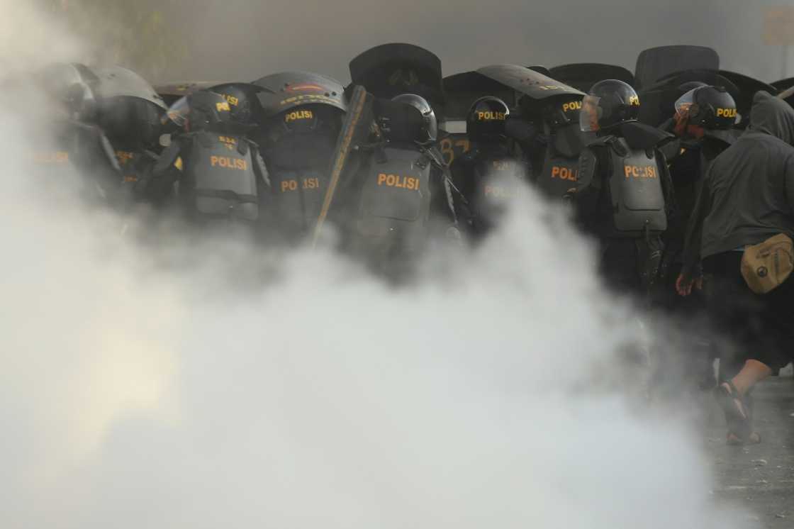 Indonesian riot police have faced off protests with aggressive means in cities across Indonesia