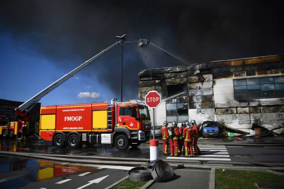 A hundred firefighters brought the blaze under control by mid-afternoon, the fire brigade said A hundred firefighters brought the blaze under control by mid-afternoon, the fire brigade said