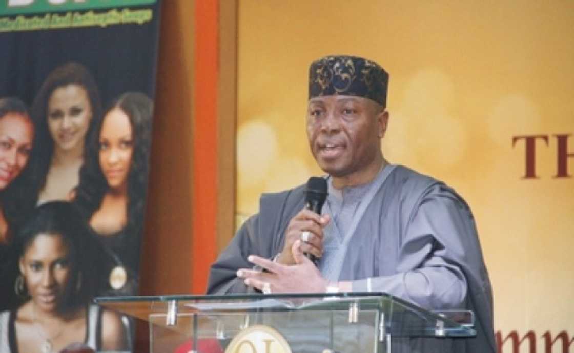 A man holding a microphone A man holding a microphone