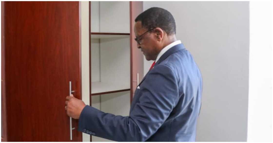 The Malawian president, Lazarus Chakwera, inspects one of the houses The Malawian president, Lazarus Chakwera, inspects one of the houses