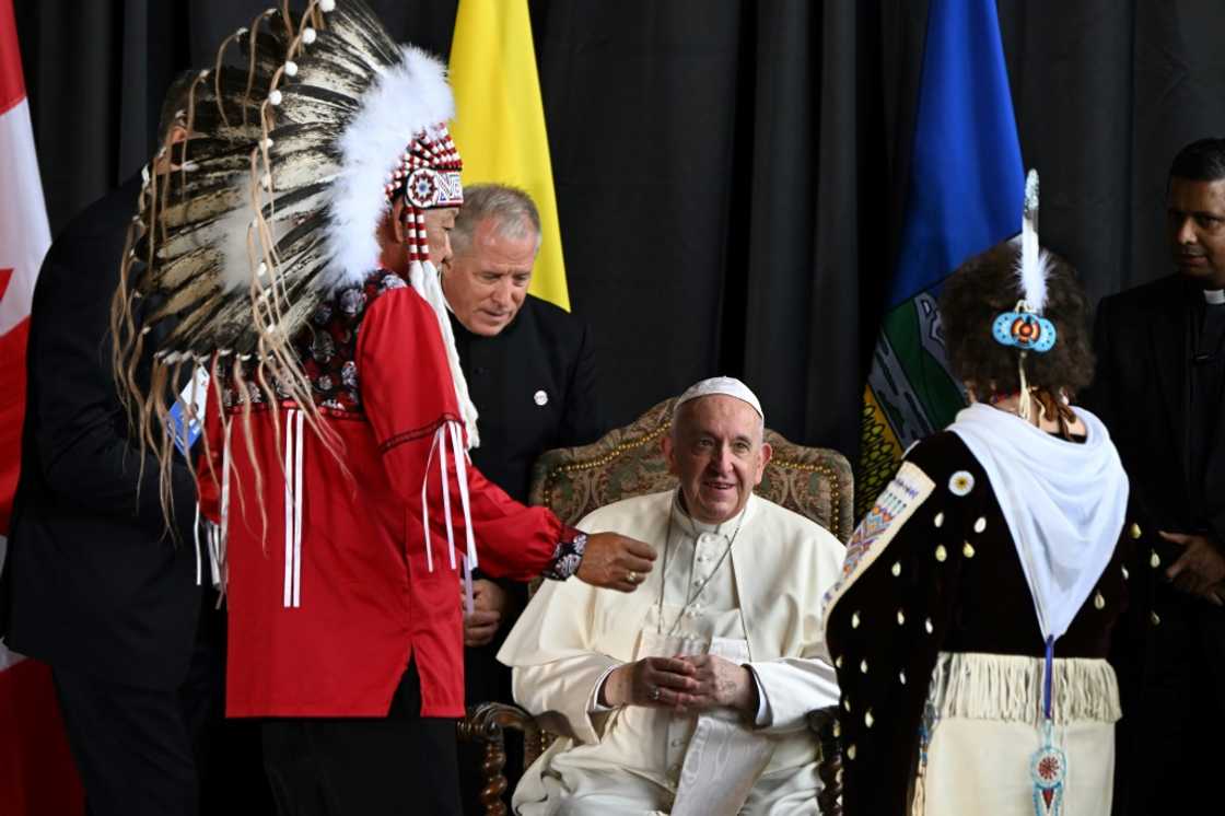 Pope Francis speaks with George Arcand (L), grand chief of the Confederacy of Treaty Six First Nations, and other Indigenous leaders during a welcoming ceremony at Canada's Edmonton International Airport on July 24, 2022 Pope Francis speaks with George Arcand (L), grand chief of the Confederacy of Treaty Six First Nations, and other Indigenous leaders during a welcoming ceremony at Canada's Edmonton International Airport on July 24, 2022