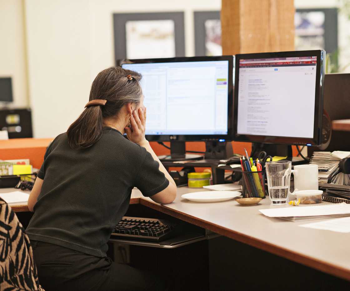A woman reading an email A woman reading an email