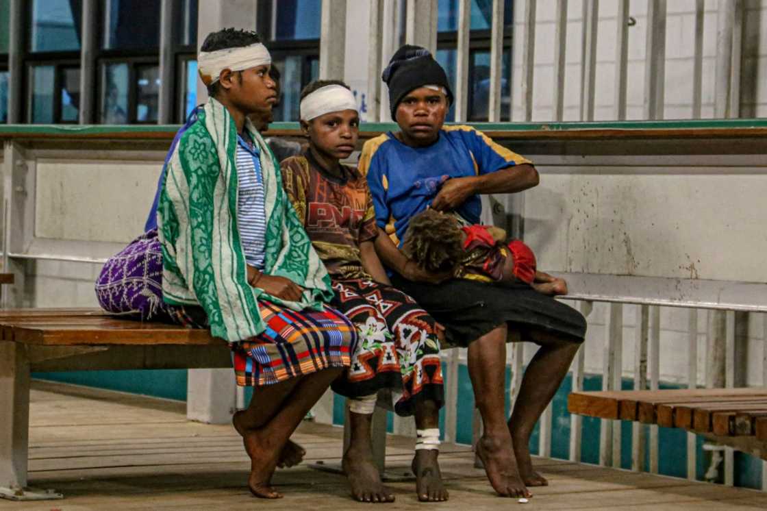 Injured villagers wait at a hospital after being evacuated by helicopter from Wauko Village following Sunday's 7.6-magnitude quake in Papua New Guinea Injured villagers wait at a hospital after being evacuated by helicopter from Wauko Village following Sunday's 7.6-magnitude quake in Papua New Guinea