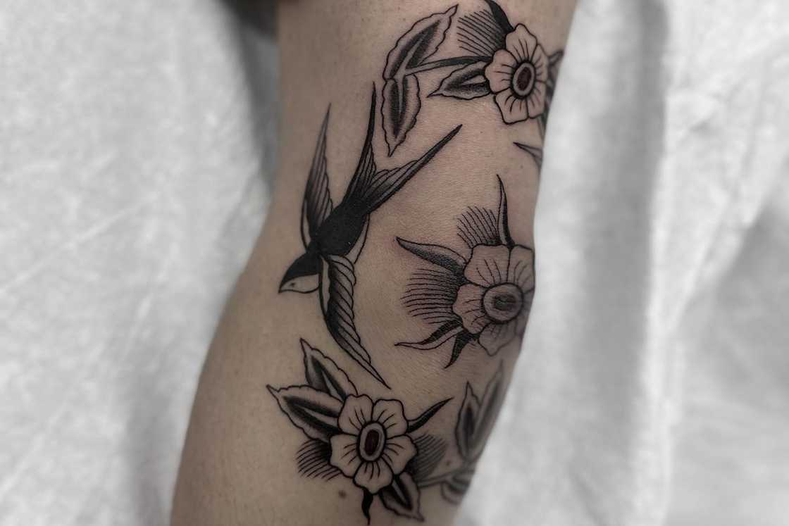 Black and grey flower elbow tattoo Black and grey flower elbow tattoo