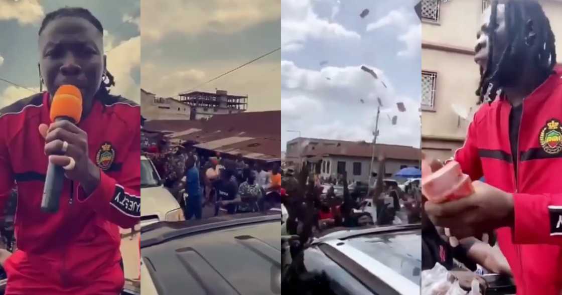 Stonebwoy mobbed as he sprays money on fans in Kumasi streets (video)
