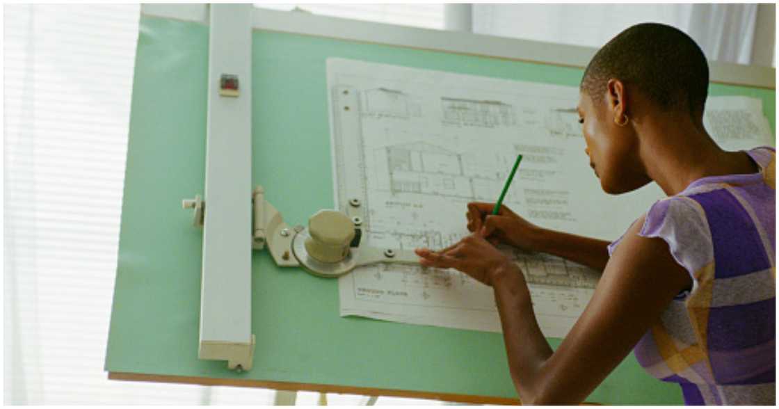 An architect sketches a house plan An architect sketches a house plan