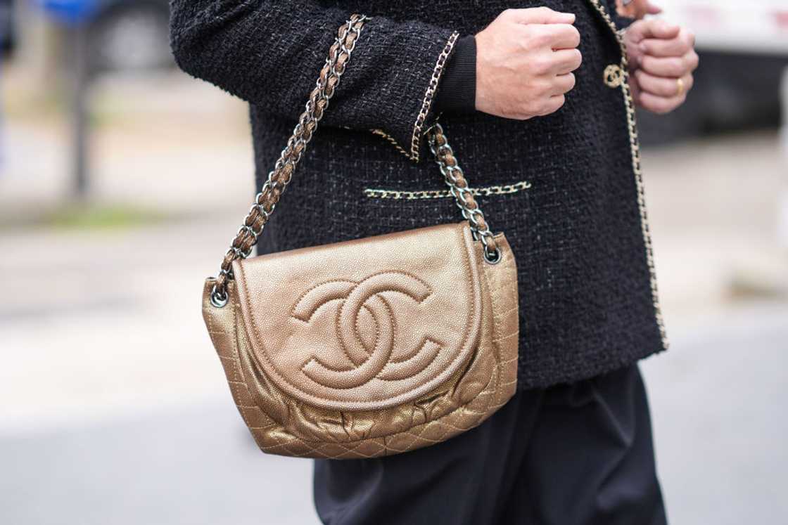 An elegant brown Chanel bag featuring the iconic double C logo. An elegant brown Chanel bag featuring the iconic double C logo.