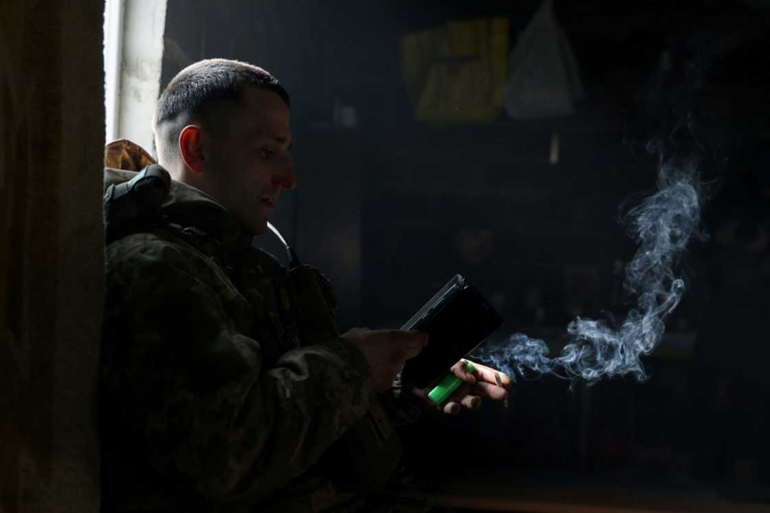 A Ukrainian soldier smokes a cigarette as he rests at a frontline in the Donetsk region A Ukrainian soldier smokes a cigarette as he rests at a frontline in the Donetsk region