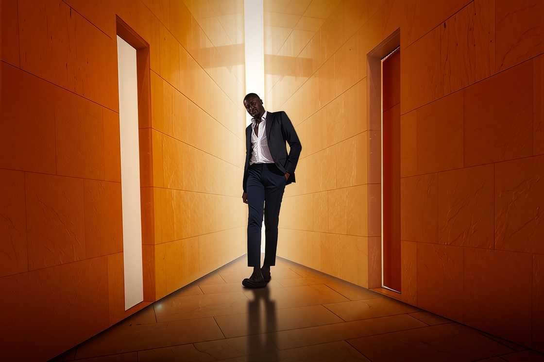 A young man walks in a suit