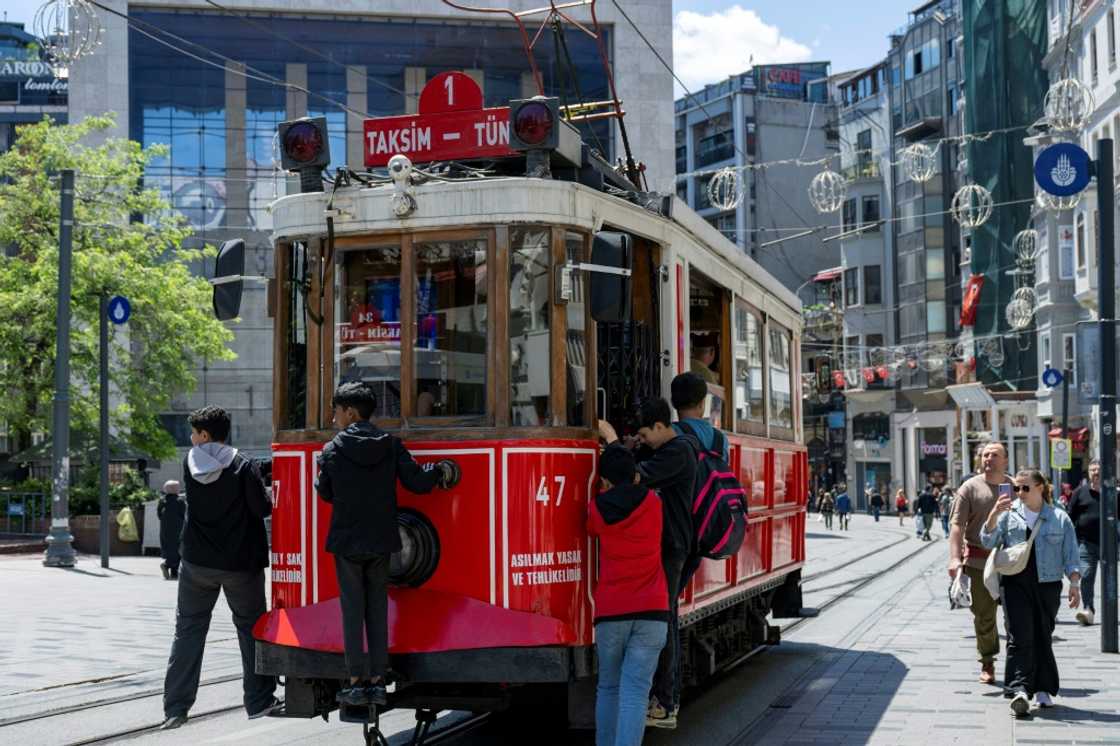 The century-old trams have become a symbol of Istanbul's Istiklal Avenue The century-old trams have become a symbol of Istanbul's Istiklal Avenue