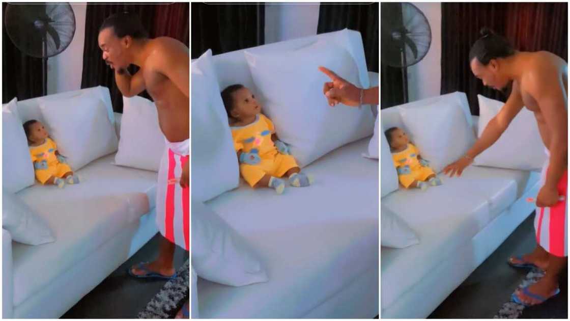 Father talked to newborn/Child looked serious. Father talked to newborn/Child looked serious.