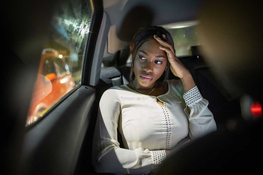 A sad lady in a car A sad lady in a car