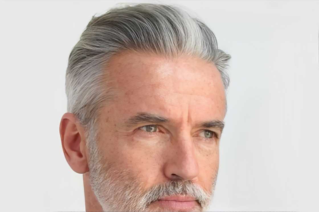 An aged white man with grey hair An aged white man with grey hair