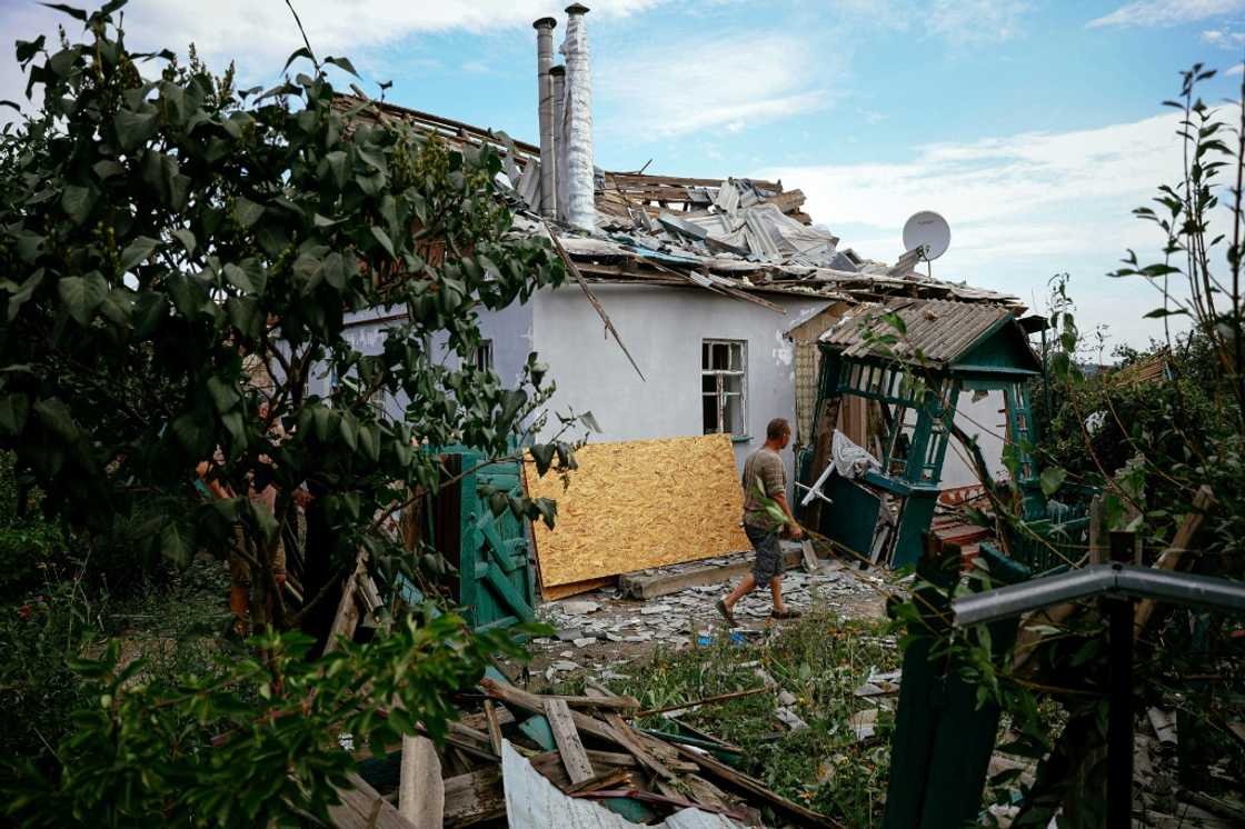 A man walks in front of a destroyed building following a rocket attack in the town of Kramatorsk in the Donetsk region of Ukraine A man walks in front of a destroyed building following a rocket attack in the town of Kramatorsk in the Donetsk region of Ukraine