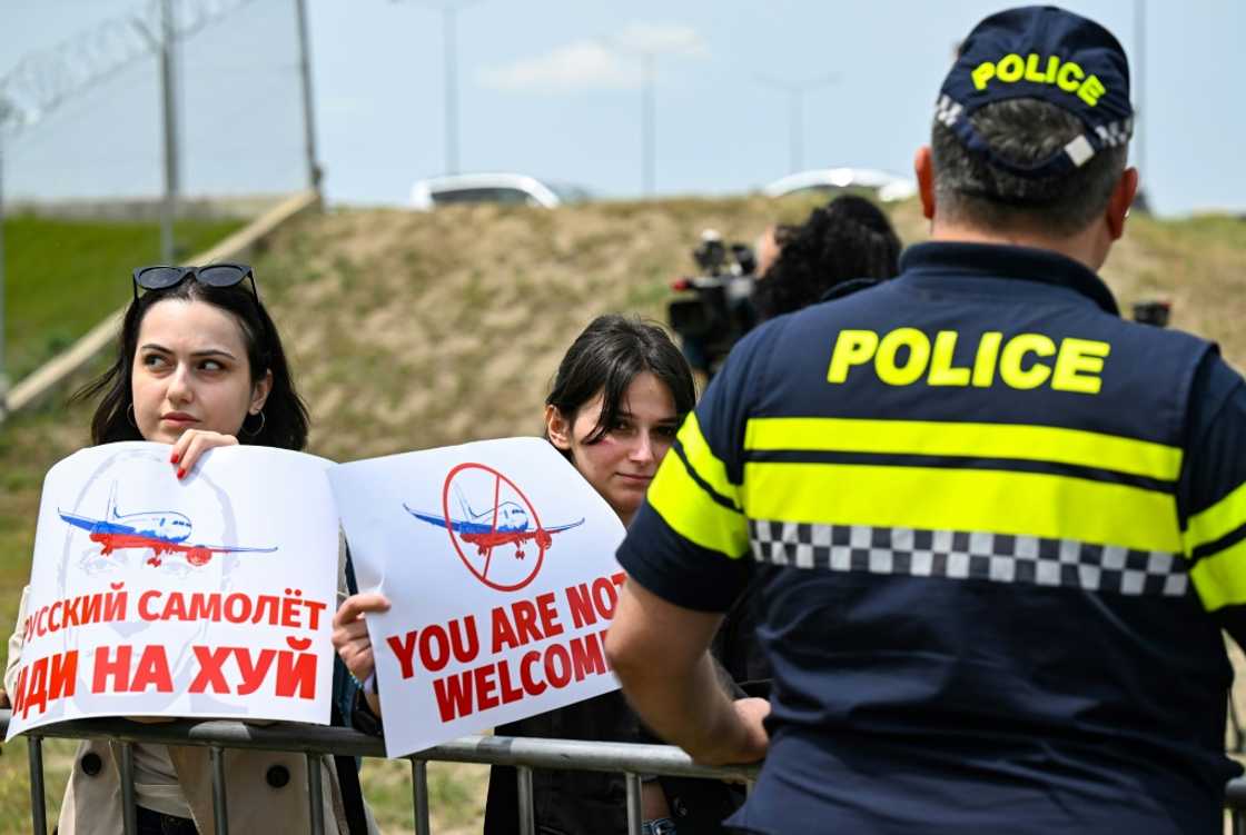 Georgian demonstrators protest against the resumption of air links with Russia outside Tbilisi Airport last week