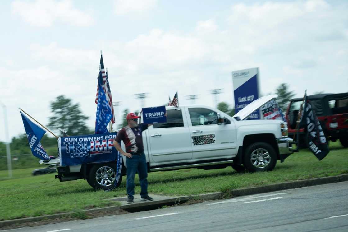 Supporters of former US president Donald Trump protest as US President Joe Biden's motorcade passes Supporters of former US president Donald Trump protest as US President Joe Biden's motorcade passes