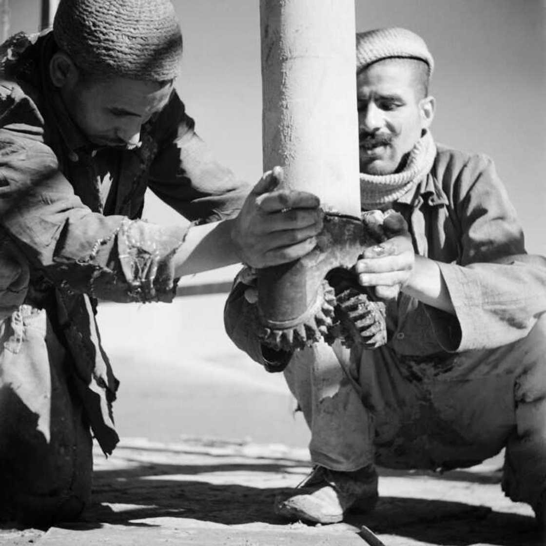 A picture from 1946 shows Moroccan workers install an oil well during prospecting in the Rharb region in the country's north-west A picture from 1946 shows Moroccan workers install an oil well during prospecting in the Rharb region in the country's north-west