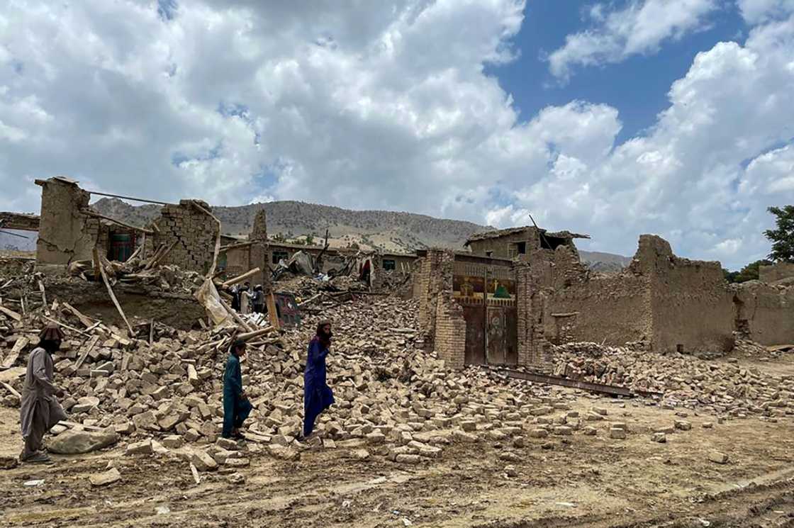 People in Afghanistan's Ghurza village walk dazed through the rubble of houses destroyed in a 5.9-magnitude earthquake that struck Bermal district, Paktika province, as desperate rescuers struggle to reach cut-off areas in the country's east People in Afghanistan's Ghurza village walk dazed through the rubble of houses destroyed in a 5.9-magnitude earthquake that struck Bermal district, Paktika province, as desperate rescuers struggle to reach cut-off areas in the country's east