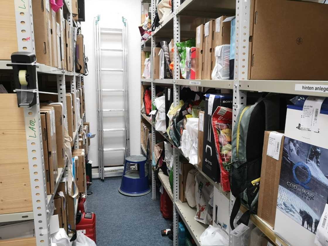 The store room is filled with items traded in for money: mobile phones, electrical devices, televisions, guitars and more The store room is filled with items traded in for money: mobile phones, electrical devices, televisions, guitars and more