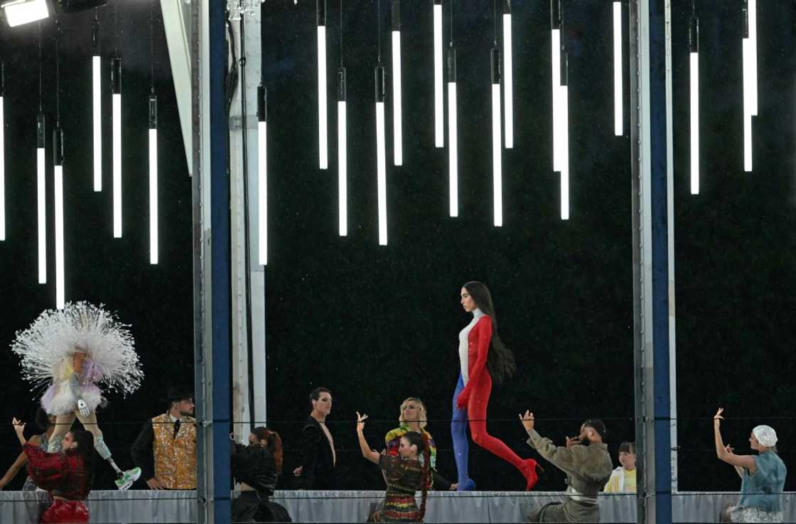 The controversial scene, which included a catwalk sequence, was intended to promote tolerance The controversial scene, which included a catwalk sequence, was intended to promote tolerance