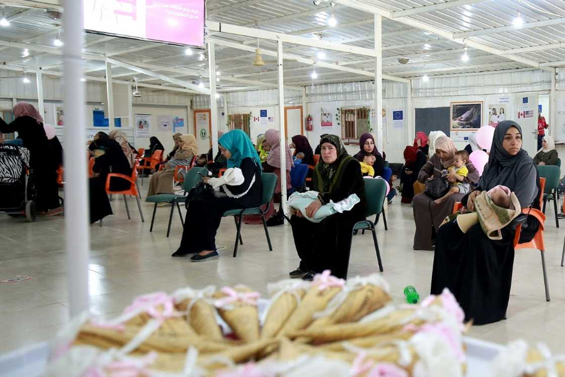 Syrian women wait for a consultation at a clinic in the Zaatari camp: the maternity ward -- the camp's biggest health facility with 60 staff -- has 10 beds Syrian women wait for a consultation at a clinic in the Zaatari camp: the maternity ward -- the camp's biggest health facility with 60 staff -- has 10 beds