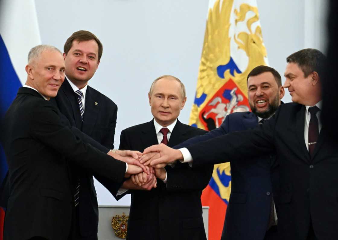 Russian-backed separatist leaders from Ukraine join hands with Russian President Vladimir Putin at a Kremlin ceremony on September 30, 2022 Russian-backed separatist leaders from Ukraine join hands with Russian President Vladimir Putin at a Kremlin ceremony on September 30, 2022