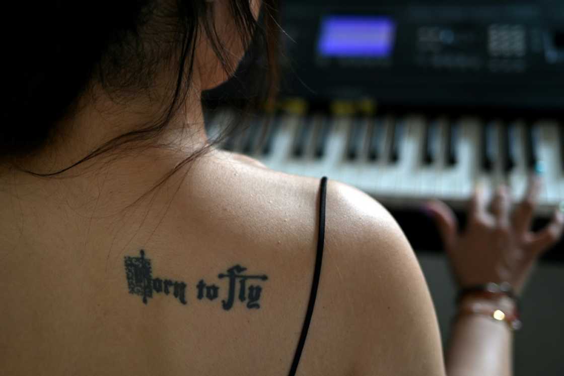 Agarwal sports a tattoo with the words "Born to Fly" on her shoulder blade Agarwal sports a tattoo with the words "Born to Fly" on her shoulder blade