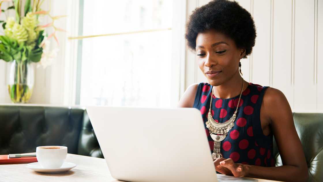 Woman using laptop at table