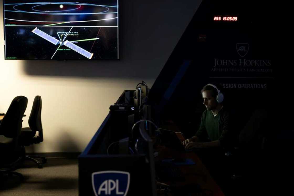 A man sits at his workstation within the Mission Operations Center for the Double Asteroid Redirection Test (DART) spaceship, which is fast approaching its target A man sits at his workstation within the Mission Operations Center for the Double Asteroid Redirection Test (DART) spaceship, which is fast approaching its target