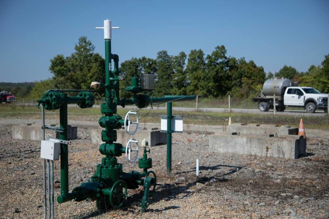 A truck from another well site drives from a Diversified Energy natural gas well site in Franklin Township, Washington County, Pennsylvania