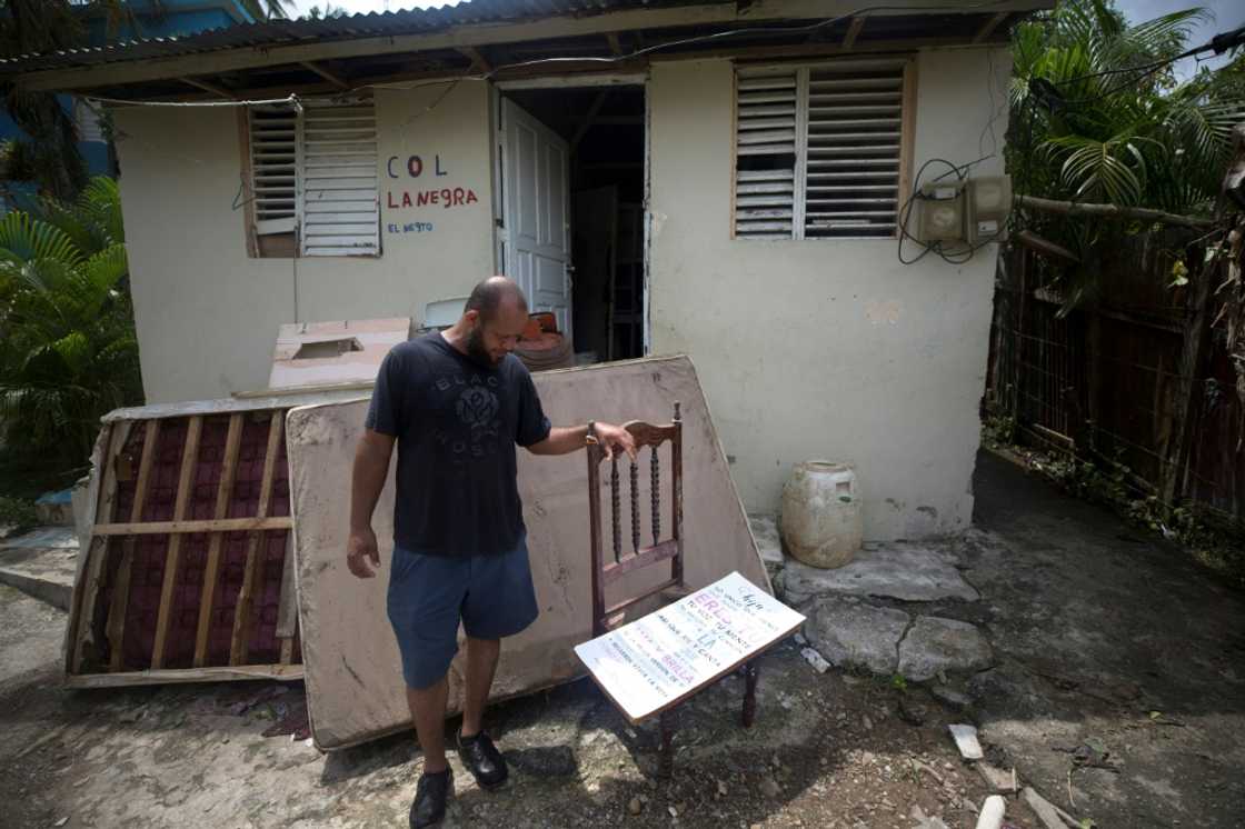 A man stands outside his house in the aftermath of Hurricane Fiona in El Seibo, Dominican Republic A man stands outside his house in the aftermath of Hurricane Fiona in El Seibo, Dominican Republic
