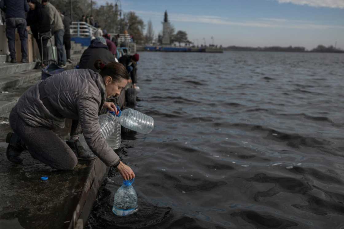 People were drawing river water in Ukraine's Kherson after supplies were knocked out People were drawing river water in Ukraine's Kherson after supplies were knocked out
