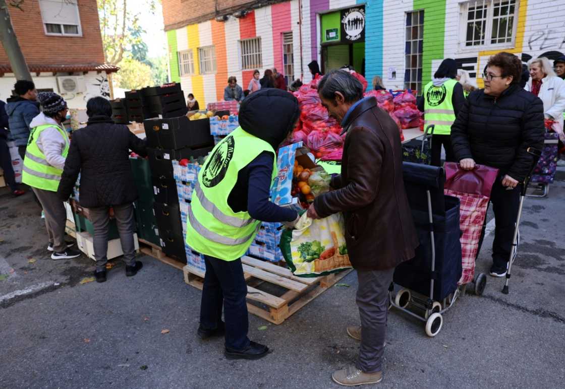 Lines dubbed 'hunger queues' can be seen regularly outside food banks across Spain Lines dubbed 'hunger queues' can be seen regularly outside food banks across Spain