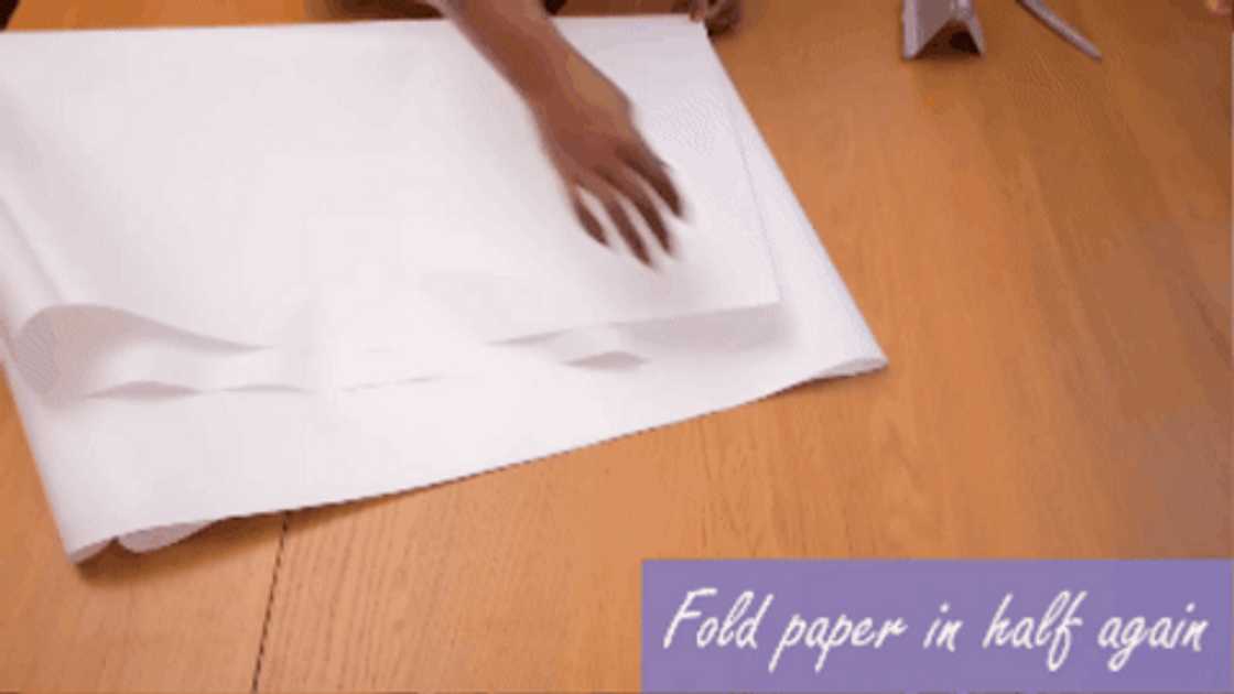 A lady making a circle skirt pattern